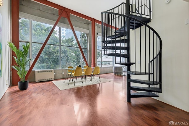 interior space featuring wood-type flooring and radiator