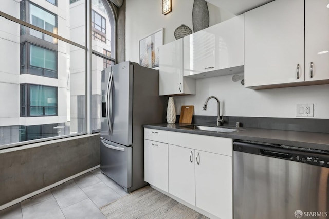 kitchen featuring sink, white cabinetry, and stainless steel appliances