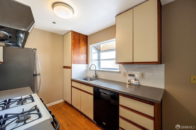 1021 San Luis Cir Unit 612, Daly City, CA 94014 - kitchen with black dishwasher, freestanding refrigerator, ventilation hood, cream cabinetry, and backsplash