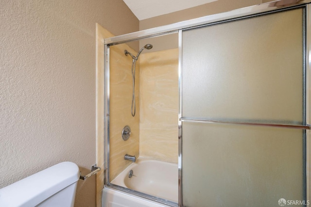 1021 San Luis Cir Unit 612, Daly City, CA 94014 - full bathroom featuring bath / shower combo with glass door and a textured wall