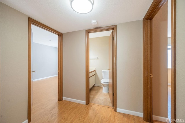 1021 San Luis Cir Unit 612, Daly City, CA 94014 - hall featuring light wood-style flooring and a textured ceiling