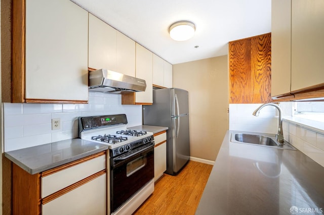 1021 San Luis Cir Unit 612, Daly City, CA 94014 - kitchen featuring gas range gas stove, wall chimney exhaust hood, light wood finished floors, and decorative backsplash