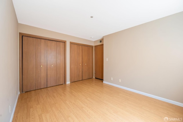 1021 San Luis Cir Unit 612, Daly City, CA 94014 - unfurnished bedroom with light wood-style floors and multiple closets