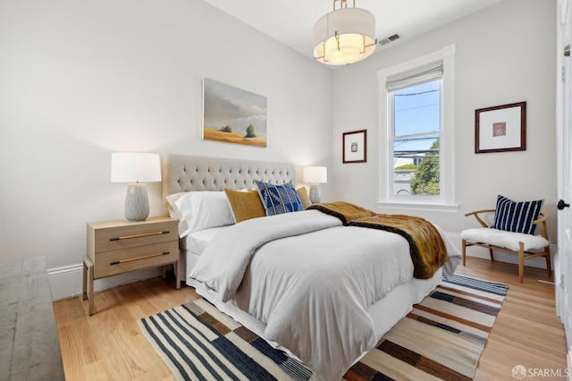3031 20th St, San Francisco, CA 94110 - bedroom with light wood-style floors and baseboards