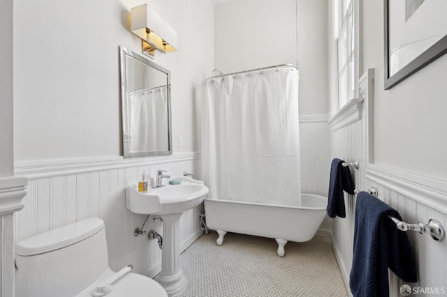 3031 20th St, San Francisco, CA 94110 - bathroom with toilet, wainscoting, a bathtub, and curtained shower