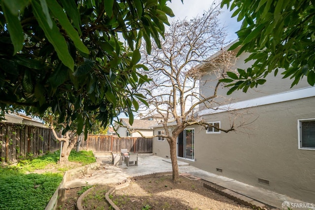 view of yard featuring a fenced backyard and a patio