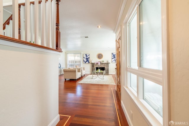 corridor featuring dark wood-style flooring, recessed lighting, and baseboards