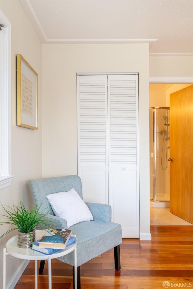 sitting room featuring wood finished floors