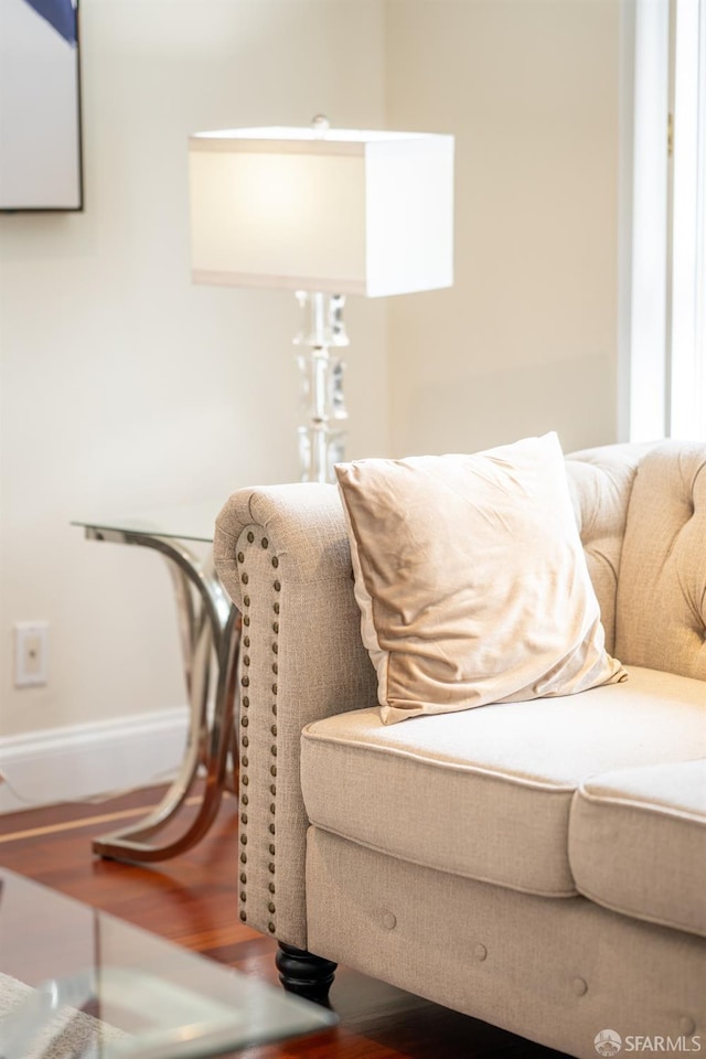 living room with baseboards and wood finished floors