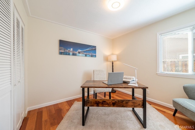 office featuring wood finished floors and baseboards