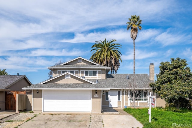 view of front of property with an attached garage, fence, driveway, roof with shingles, and stucco siding