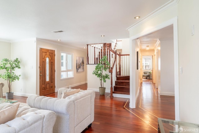 entrance foyer featuring baseboards, crown molding, stairway, and dark wood-type flooring