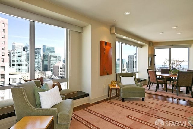 765 Market St Unit 22D, San Francisco, CA 94103 - living room with a skyline view, wood finished floors, plenty of natural light, and recessed lighting