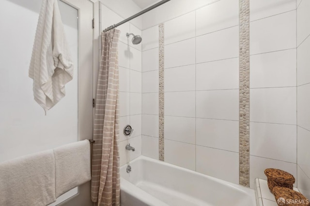 bathroom with shower / tub combo with curtain