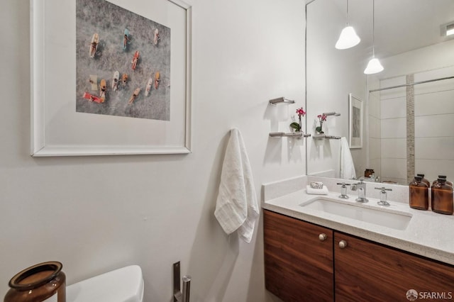 bathroom with vanity and toilet