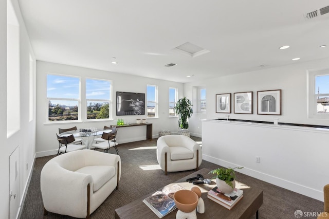 living room featuring dark colored carpet