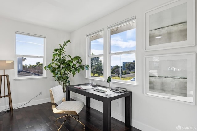 home office with dark hardwood / wood-style flooring