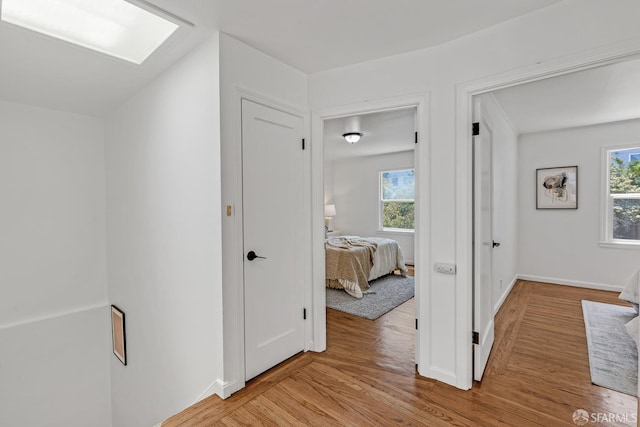 1187 Hollister St, San Francisco, CA 94124 - hall with light wood-style floors and baseboards