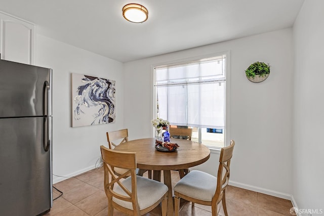 1187 Hollister St, San Francisco, CA 94124 - dining space with light tile patterned floors and baseboards