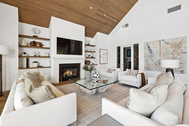 living room featuring built in shelves, wood ceiling, light hardwood / wood-style floors, and high vaulted ceiling