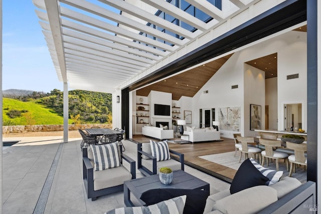 view of patio / terrace featuring an outdoor living space and a pergola