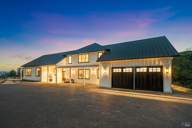 modern inspired farmhouse with a pergola and a garage