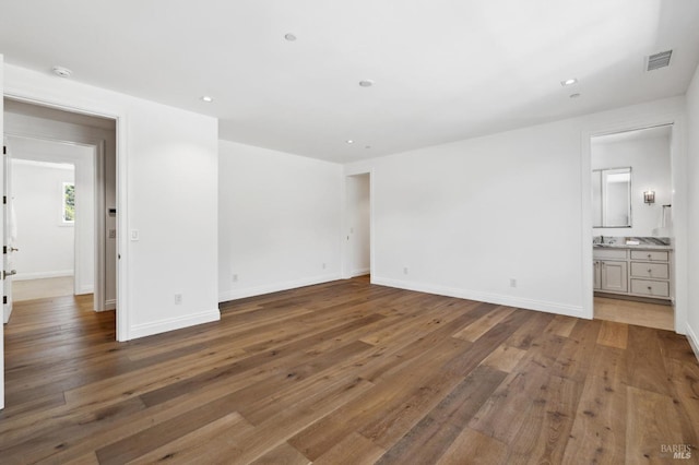 spare room with dark hardwood / wood-style flooring