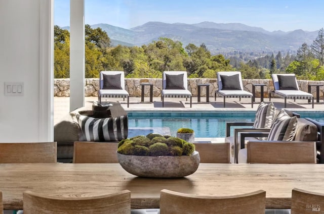 view of swimming pool featuring a mountain view