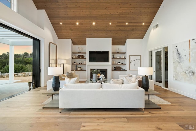 living room with high vaulted ceiling, wooden ceiling, and light hardwood / wood-style flooring