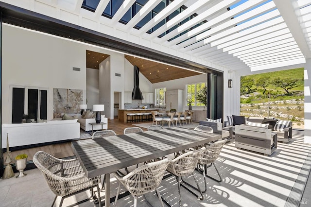 view of patio / terrace featuring an outdoor living space and a pergola