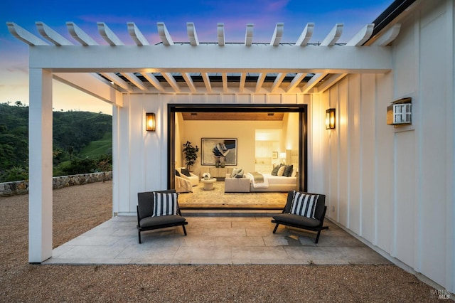 view of patio terrace at dusk