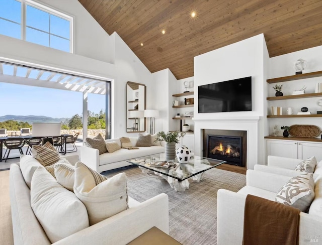 living room featuring high vaulted ceiling, a mountain view, and wooden ceiling