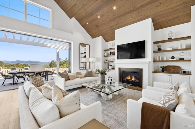 living room with a mountain view, high vaulted ceiling, wood ceiling, and light wood-type flooring