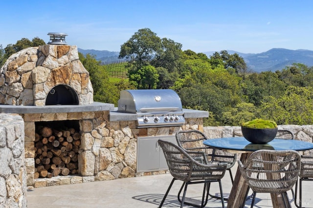 view of patio with a mountain view, grilling area, and area for grilling