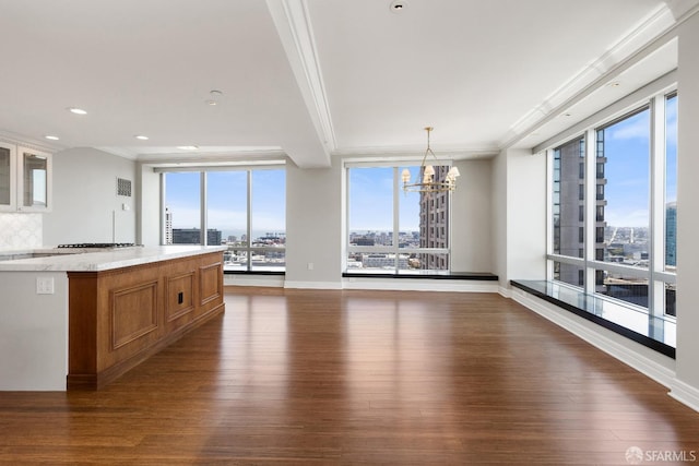 765 Market St Unit 25G, San Francisco, CA 94103 - kitchen featuring dark wood-style floors, brown cabinets, a chandelier, glass insert cabinets, and crown molding