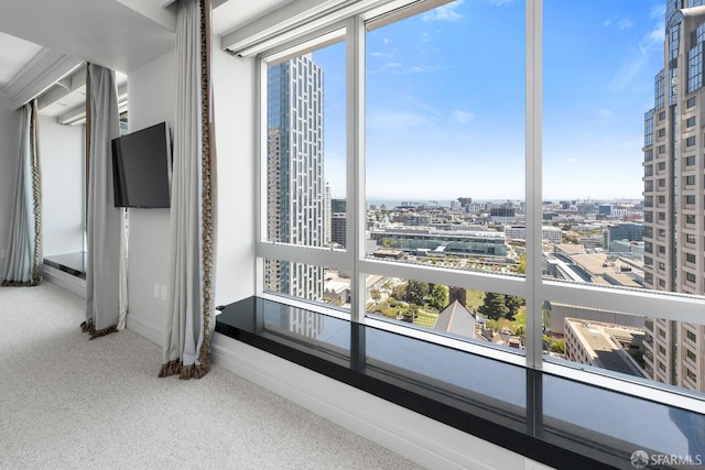 765 Market St Unit 25G, San Francisco, CA 94103 - unfurnished room featuring plenty of natural light, carpet floors, and baseboards