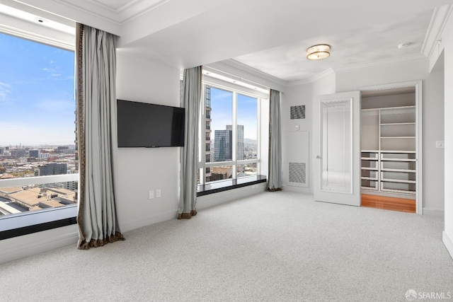 unfurnished bedroom featuring a closet, carpet, and ornamental molding