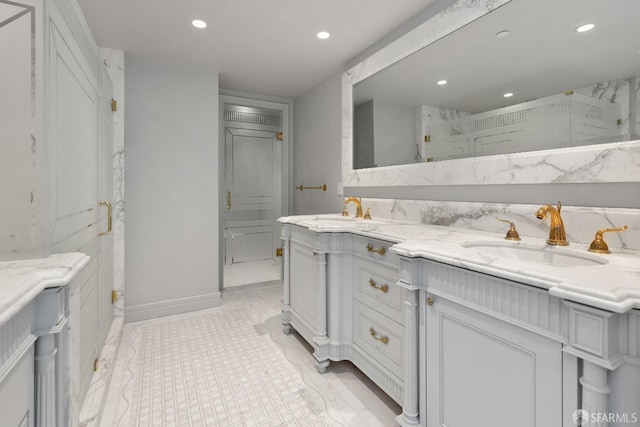 bathroom featuring vanity and a shower with door