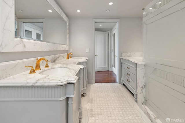 bathroom with hardwood / wood-style flooring and vanity