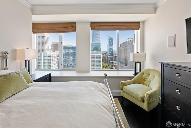 bedroom featuring ornamental molding and multiple windows