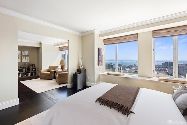 bedroom with multiple windows, crown molding, and dark hardwood / wood-style flooring