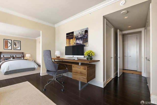 bedroom with ornamental molding and dark hardwood / wood-style flooring