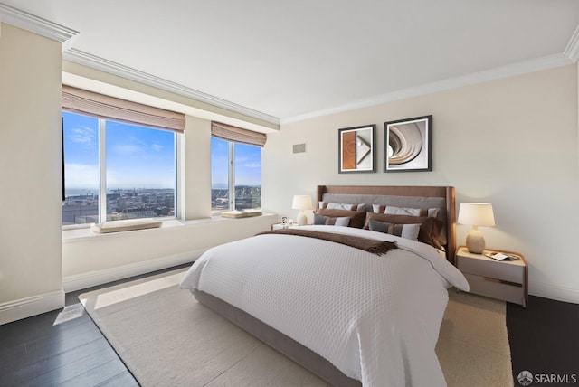 bedroom featuring wood-type flooring and ornamental molding