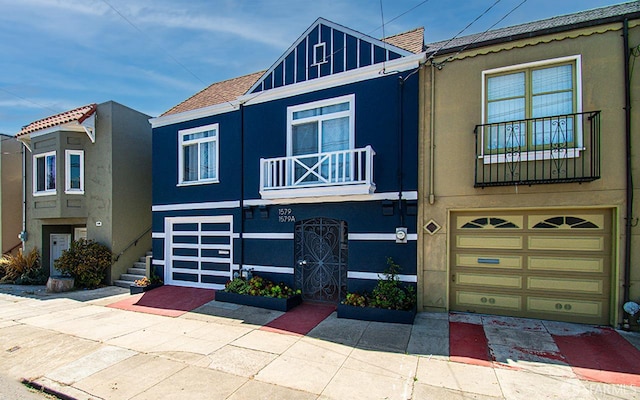 1579 46th Ave, San Francisco, CA 94122 - view of property with an attached garage, stucco siding, and driveway
