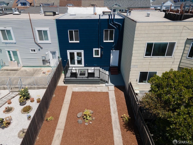 1579 46th Ave, San Francisco, CA 94122 - rear view of property featuring french doors, a residential view, and a fenced backyard