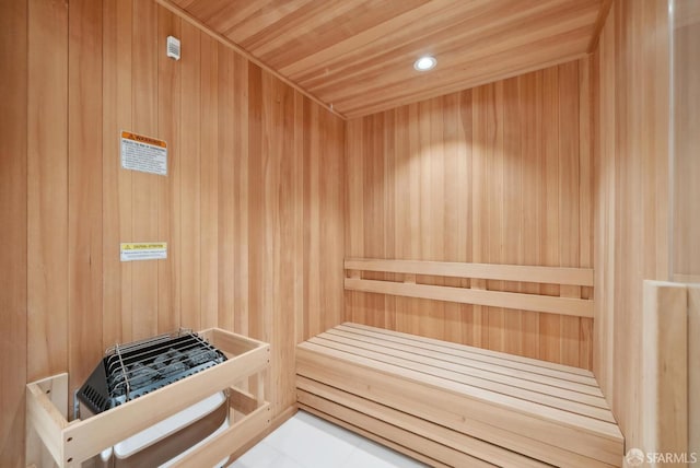 sauna / steam room with wood walls and recessed lighting