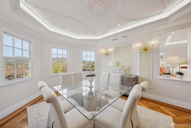 dining space with crown molding, a tray ceiling, baseboards, and recessed lighting