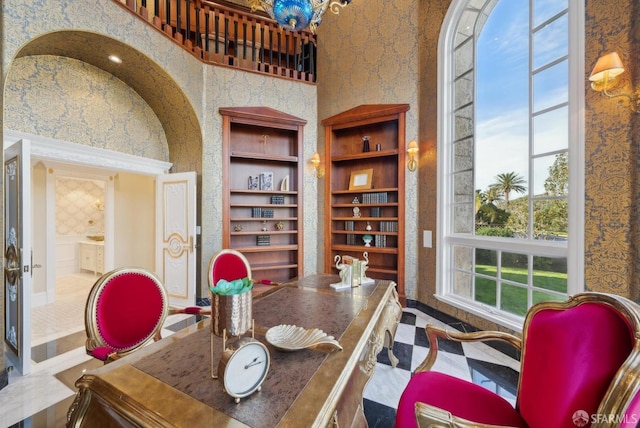 home office with baseboards and built in features