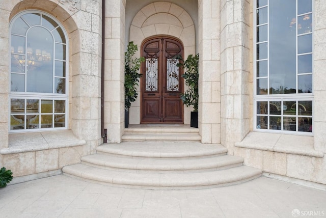 view of exterior entry featuring stone siding