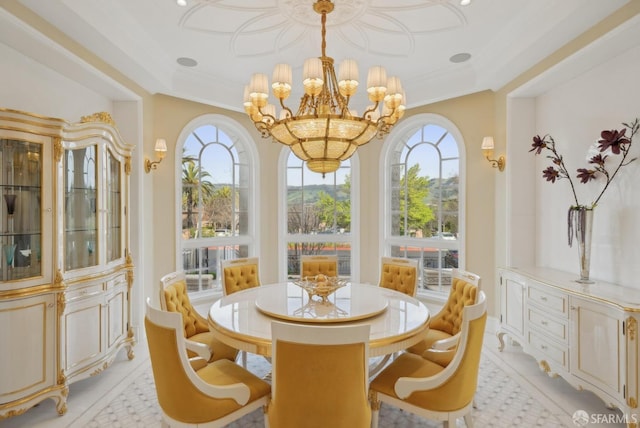 dining area featuring healthy amount of natural light, a chandelier, light tile patterned flooring, and crown molding